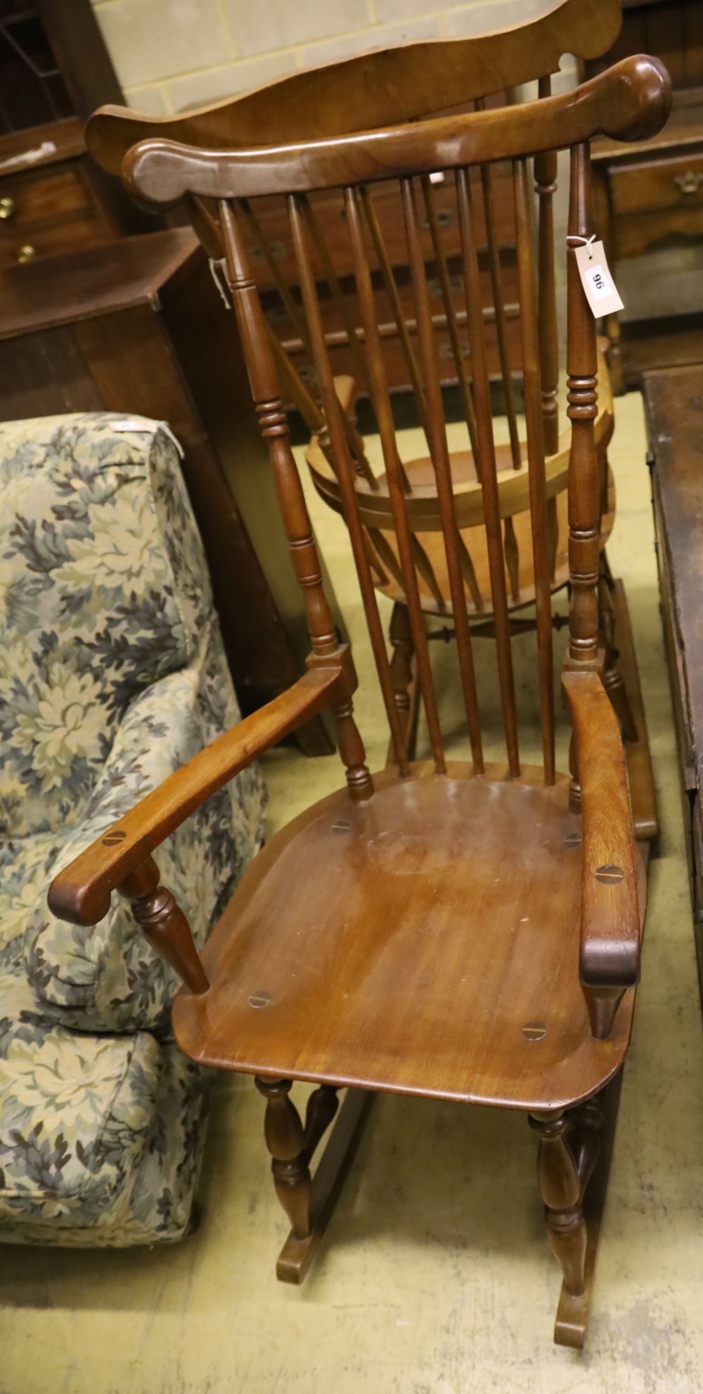 Two beech wood spindle back rocking armchairs, width 56cm, depth 55cm, height 128cm